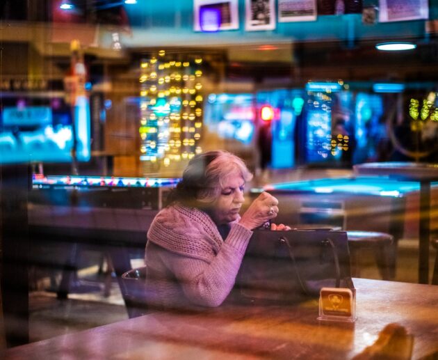 woman sitting at the table inside room