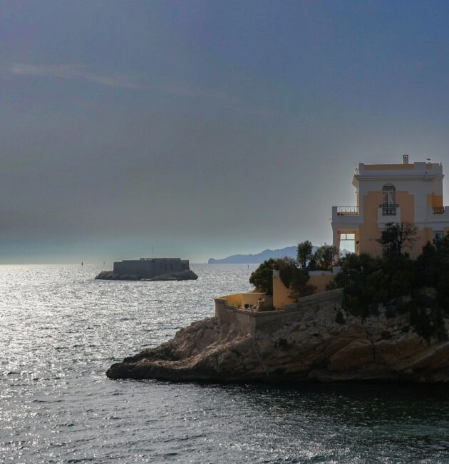 a house on an island in the middle of the ocean