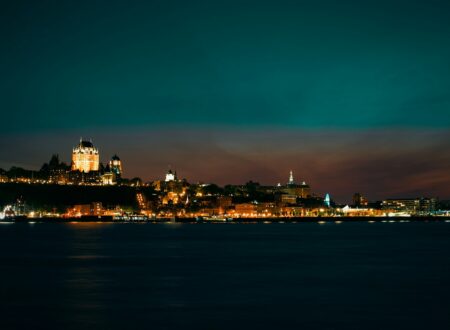 a view of a city at night from the water