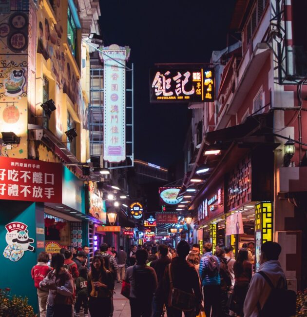 group of people at the street in between of buildings